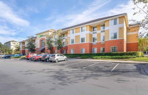 a parking lot in front of a large building at Extended Stay America Suites - Orlando - Lake Buena Vista in Orlando