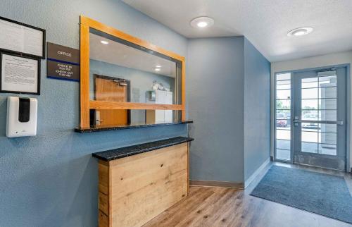 a room with a counter with a mirror and a window at Extended Stay America Select Suites - Indianapolis - Lawrence in Fishers