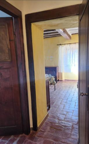 an open door to a room with a bedroom at Casa Alfonsina in Veccialone