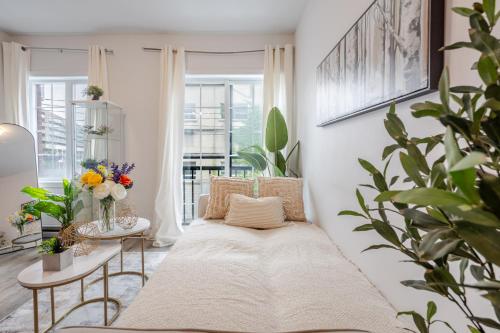 a living room with a couch and a table at Fashionable 3BR in Griffintown in Montréal
