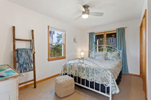 a bedroom with a bed and a window at 8074 - Sea Glass Charmer in Avon
