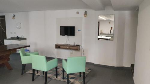 Uma TV ou centro de entretenimento em Hostel Residencial Botânico