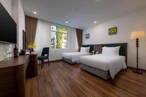 Voodi või voodid majutusasutuse Hanoi Vista Hotel toas