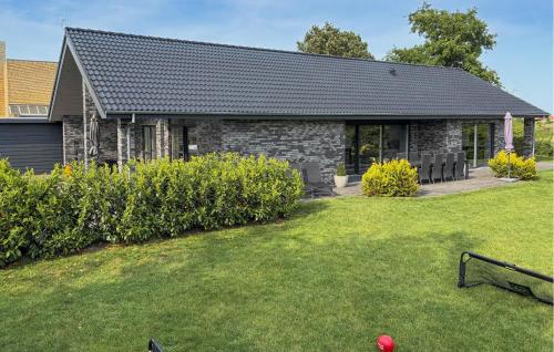 a house with a yard in front of it at Amazing Home In Grenaa With Wifi in Grenå