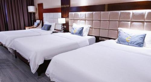 Katil atau katil-katil dalam bilik di Telecom Hotel Guilin