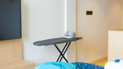 a phone sitting on a table in a room at Whale Shark Boutique in Fenfushi