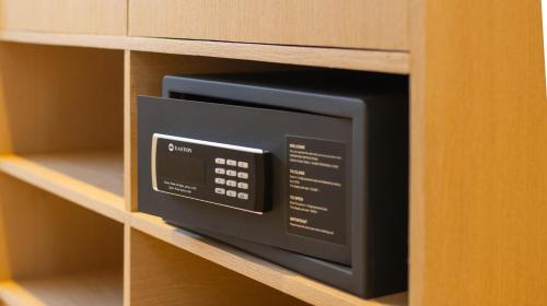 a microwave oven on a shelf in a cabinet at Whale Shark Boutique in Fenfushi