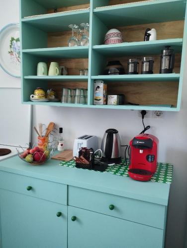 a kitchen with a counter with a toaster on it at White Cat in Vromolithos