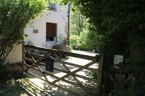 a wooden gate in front of a house at Dolomiti house in Cibiana