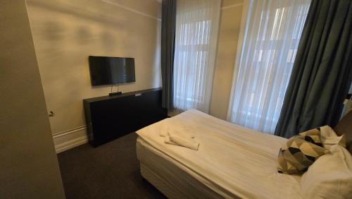 TV a/nebo společenská místnost v ubytování Hotel Hötorget