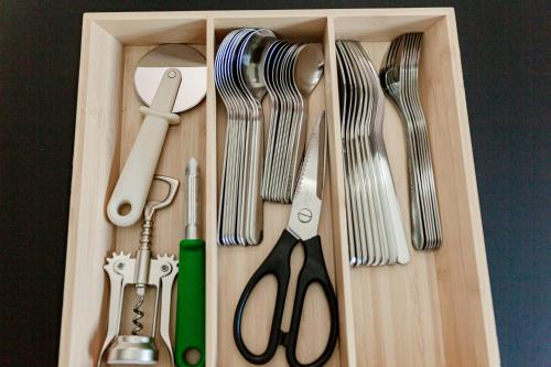a wooden box with utensils in it at Ferienhaus Arina in Bad Bertrich