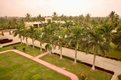 an aerial view of a park with palm trees at لاكجري صلالة Luxury salalah Villa in Salalah