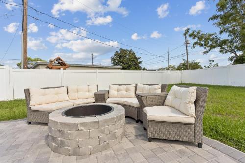 a patio with two chairs and a fire pit at 3Bd 2Ba House with Parking Laundry and Large Patio in Largo
