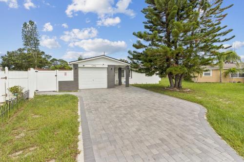a driveway with a garage in a yard at 3Bd 2Ba House with Parking Laundry and Large Patio in Largo