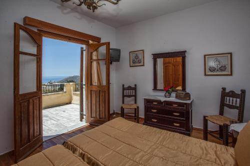 A bed or beds in a room at Petrinos Milos