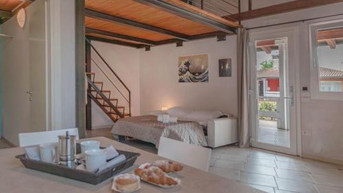 a living room with a bed and a table at Camping Grande Italia in Chioggia