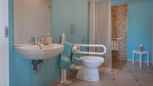 a bathroom with a sink and a toilet at Camping Grande Italia in Chioggia