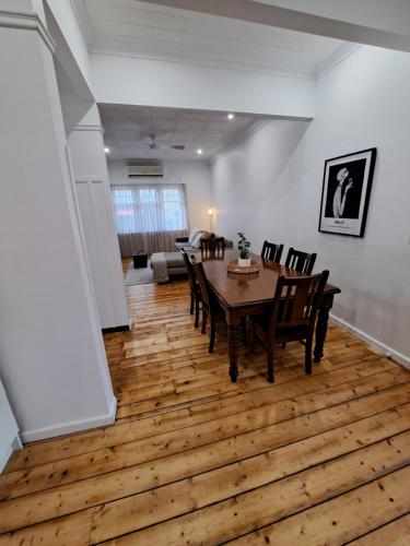 a dining room with a table and chairs at Barnard Bungalow in Bendigo