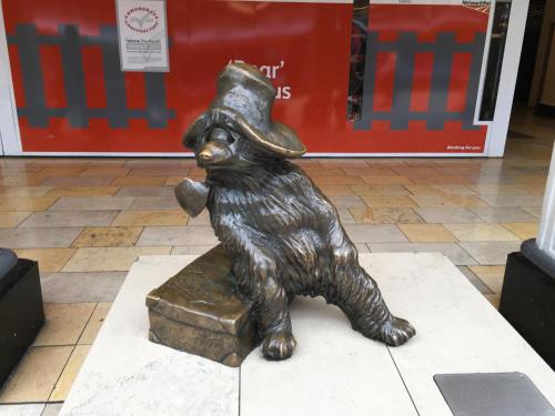 a statue of a dog with a hat on a box at St George Hotel in London