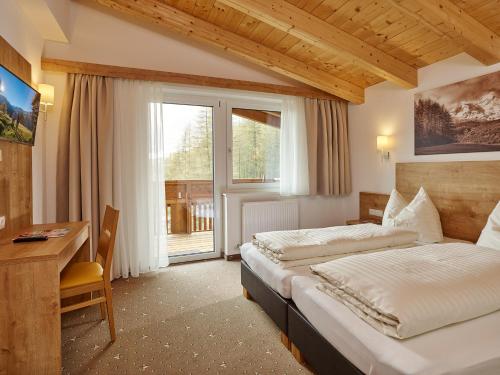 Posteľ alebo postele v izbe v ubytovaní Appartement Gästehaus Bergkristall