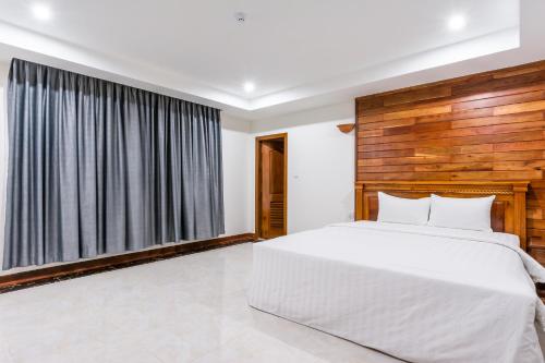 Ein Bett oder Betten in einem Zimmer der Unterkunft Relax Hotel