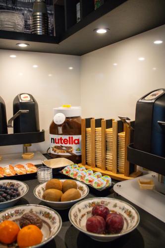a buffet with plates of food on a table at Hotel Am Sportpark in Duisburg