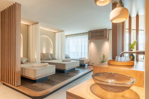 a living room with a couch and a table at Alea Living in Tirolo