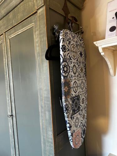a tie hanging on the door of a cabinet at Nido di Gufi in Todi