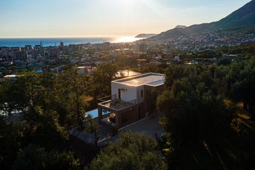 a house on a hill with a view of the city at Villa Amara in Bar