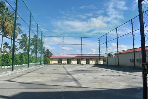 a large fence in the middle of a parking lot at Areca Gateway Eco Tourism Center in Nandigunda