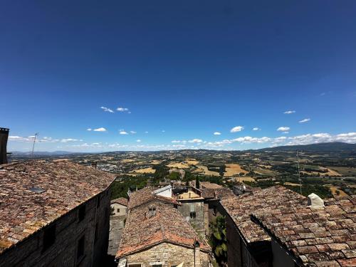 a view of a city from the roofs of buildings at Nido di Gufi in Todi