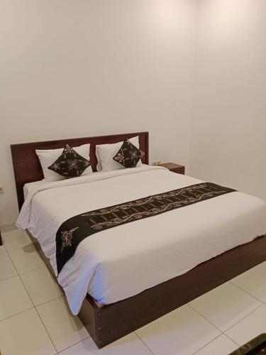 Ένα ή περισσότερα κρεβάτια σε δωμάτιο στο Maha Home Stay Tulamben