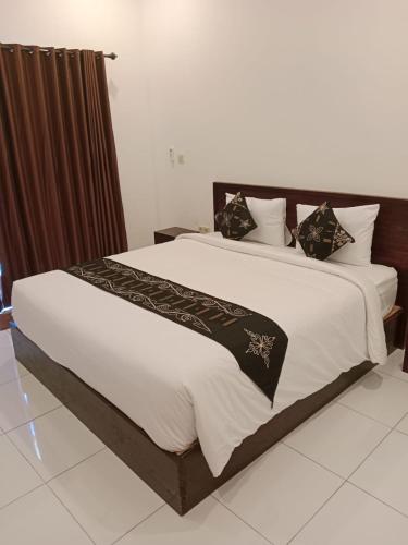 Ένα ή περισσότερα κρεβάτια σε δωμάτιο στο Maha Home Stay Tulamben