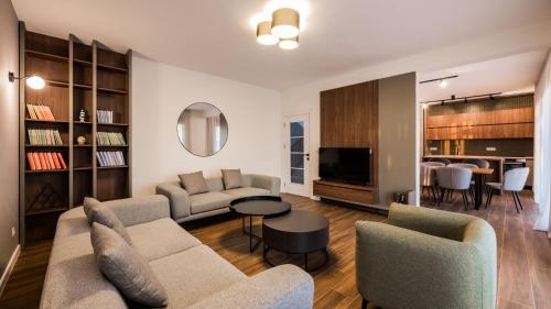 a living room with two couches and a television at Villa Amara in Bar