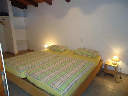 a bedroom with a bed with two pillows on it at Villa Ana in Savudrija