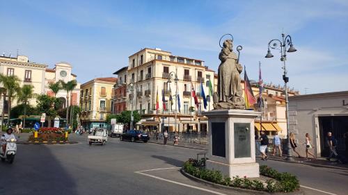 a statue in the middle of a city street at A casa di Erica in Sorrento