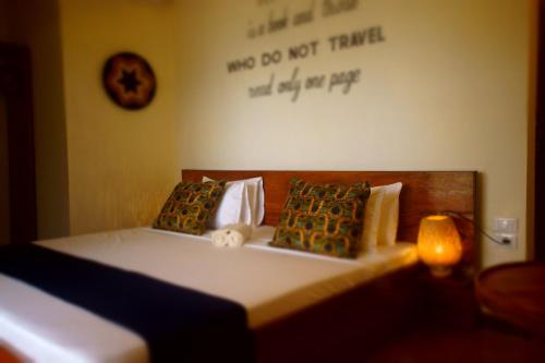 Ένα ή περισσότερα κρεβάτια σε δωμάτιο στο Amani Beach Villa