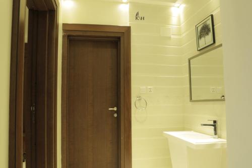 a bathroom with a toilet and a sink at شقق الكادي in Najran