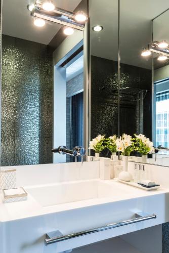a bathroom with a sink and a mirror at Bilek Hotel Kavacık in Istanbul
