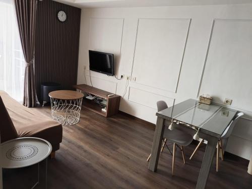 TV a/nebo společenská místnost v ubytování The Wave Apartment