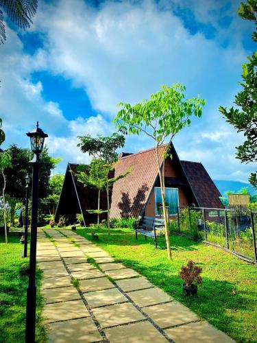 a house with a street light in front of it at Kap Korome Village Resort in Koroth