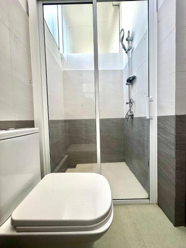 a bathroom with a shower with a toilet at Terrace Kandy in Kandy