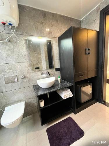 a bathroom with a sink and a toilet at Khas Mahal Homestay in Agra