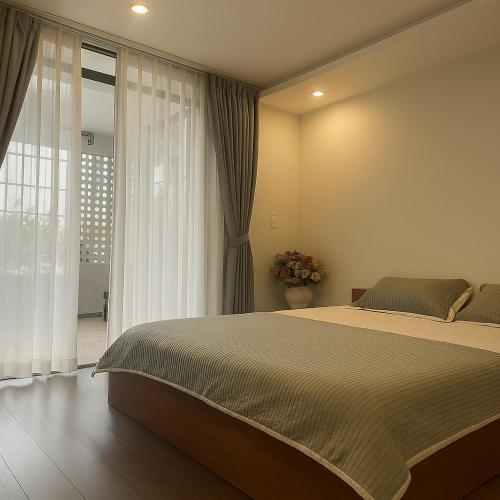 Ένα ή περισσότερα κρεβάτια σε δωμάτιο στο Homestay Bối Bối