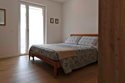 Postel nebo postele na pokoji v ubytování CasaNegrano - Apartaments