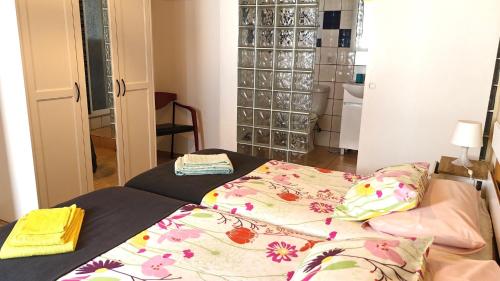 a bedroom with a bed with a blanket on it at Casa d'Avó in Carrapateira