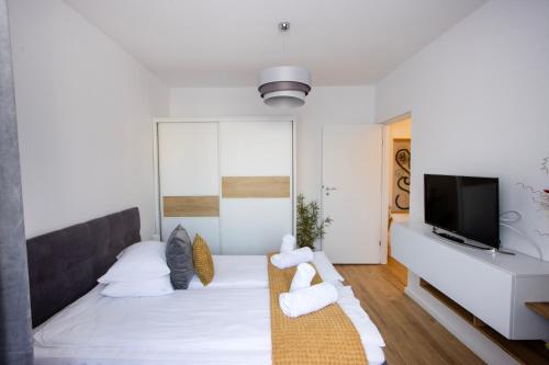 Postel nebo postele na pokoji v ubytování Bethlen Apartman