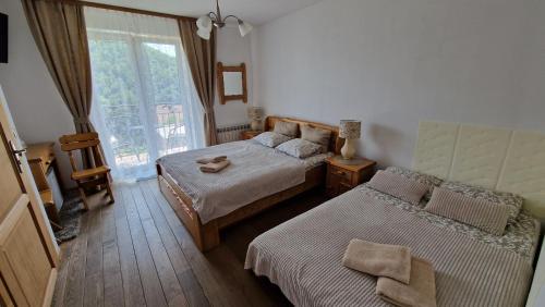 Postel nebo postele na pokoji v ubytování Pokoje u Celinki