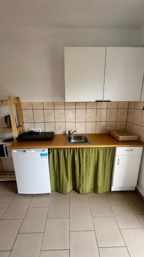 a kitchen with a sink and a counter top at Pokoje Gościnne Lipowa in Czaplinek