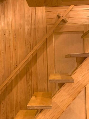 a set of wooden stairs in a wooden wall at 스테이 편차 in Pyeongchang 